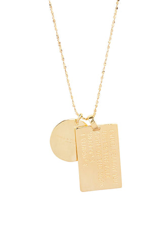 close-up-back-view-of-spell-s-sagittarius-stargazer-zodiac-necklace-charms-one-charm-is-of-a-rectangular-shape-and-an-inspirational-quote-while-the-other-charm-is-circular-the-brand-name